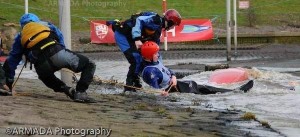 Helping a swimmer from the water